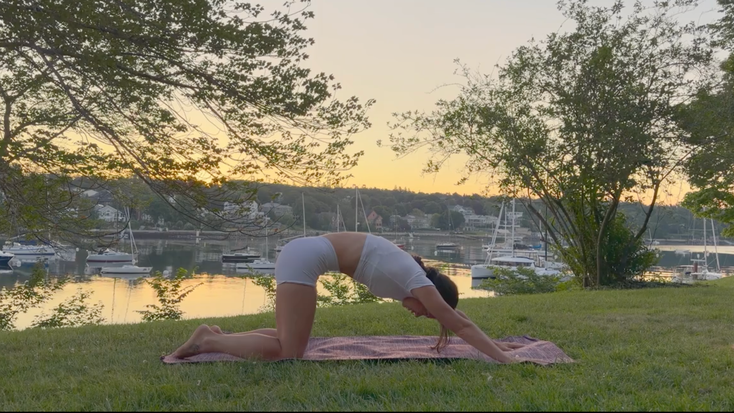 Yoga teacher Emily Baltzer in Puppy Pose, part of her morning yoga flow